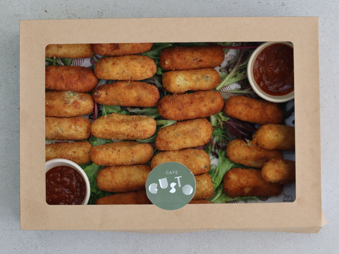 A selection of hand crafted cheese and bacon croquets. Beautifully presented in a catering box for cafe gusto.