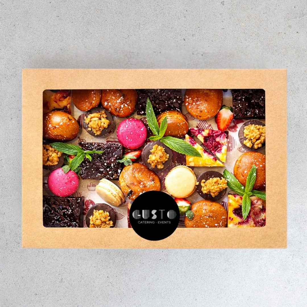 Box of assorted chocolates with 'Gusto' branding on a gray background